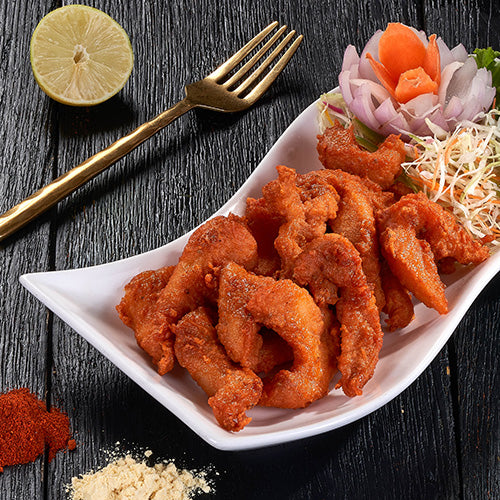 a plate of Amritsari Macchi, a deep-fried fish fillet marinated in spices, at Ganesha Ek Sanskriti Indian Restaurant