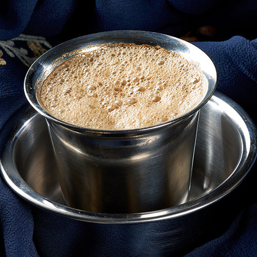 A refreshing glass of Masala Chaas, a traditional Indian yogurt drink made with homemade yogurt, coriander, ginger, and Indian spices