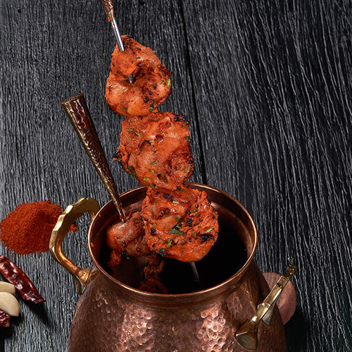 Tender pieces of Chicken Tikka marinated in yogurt and spices at an Indian Restaurant