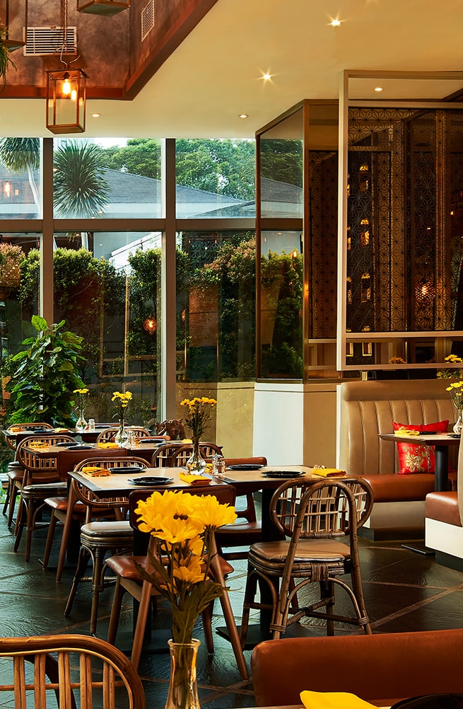 A spacious dining room with elegant décor at Ganesha Ek Sanskriti, a renowned Indian Restaurant in Ganesha Menara Karya, Jakarta.