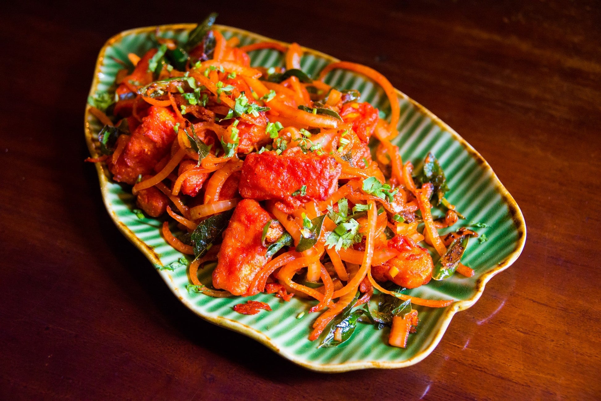 A plate of crispy Paneer 65, a spicy and flavorful Indian appetizer