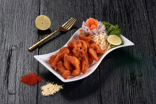 a plate of Amritsari Macchi, a deep-fried fish fillet marinated in spices, at Ganesha Ek Sanskriti Indian Restaurant