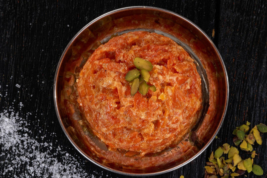 A warm and comforting Indian dessert, Gajar Ka Halwa, made with shredded carrots, milk, sugar, and cardamom