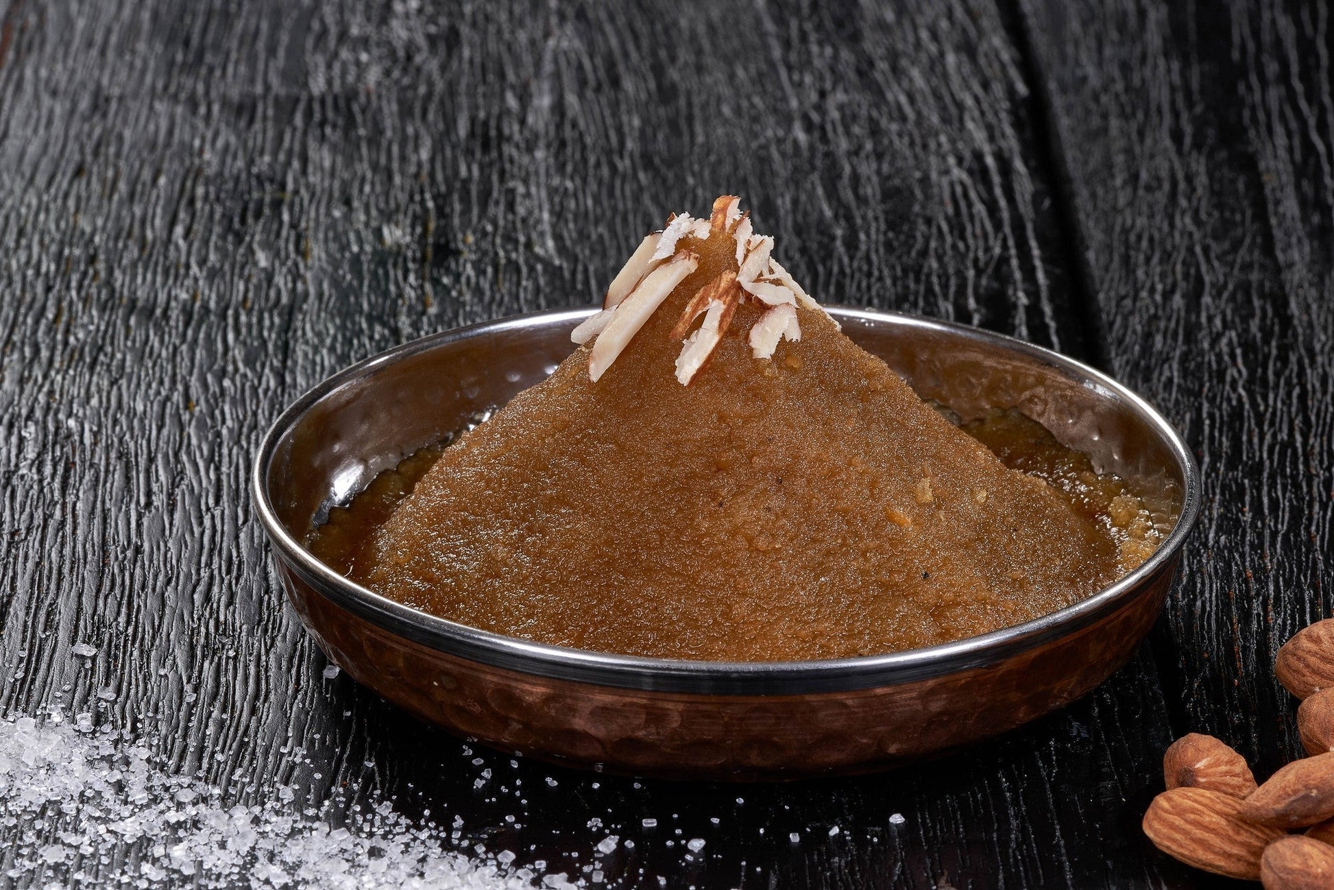 A sweet and nutty Indian pudding, Moong Dal Halwa, made with lentils, cardamom, and sugar