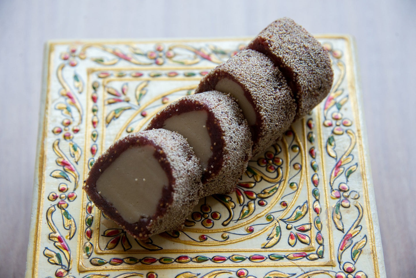 A sweet and nutty Indian dessert, Anjeer Roll, made with dried figs, nuts, and spices, rolled into bite-sized balls