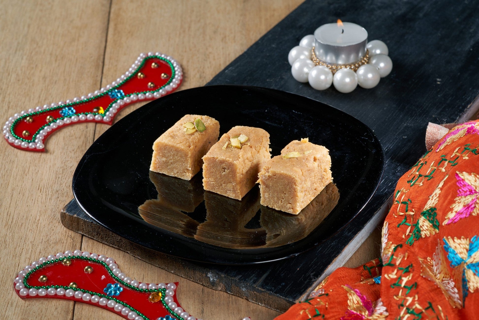 A delectable Indian dessert, Milk Cake, made with milk, sugar, and nuts, cut into diamond-shaped pieces
