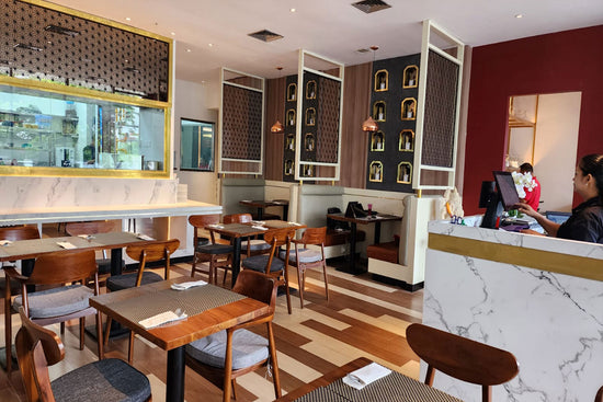 A spacious and inviting Indian restaurant interior with ample seating for both small and large groups