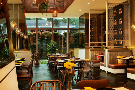 A spacious dining room with elegant décor at Ganesha Ek Sanskriti, a renowned Indian Restaurant in Ganesha Menara Karya, Jakarta.