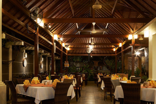 A cozy Indian restaurant with a rustic wooden roof, offering a taste of authentic Indian cuisine in Ganesha Sanur (Bali).