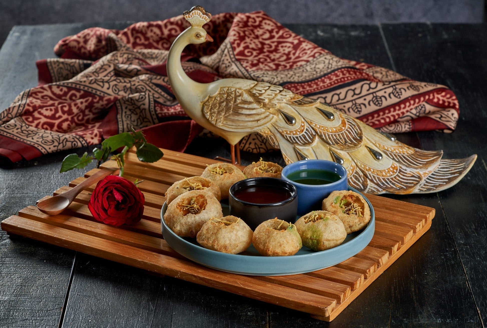 A plate of Pani Puri, a crispy and savory Indian snack filled with a tangy and spicy water