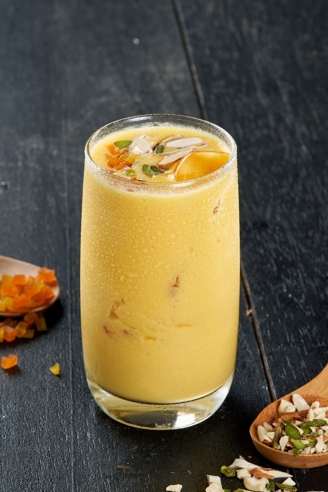 Refreshing Mango Lassi, a creamy blend of mangoes, yogurt, and spices, a perfect thirst quencher at Ganesha Ek Sanskriti Indian Restaurant