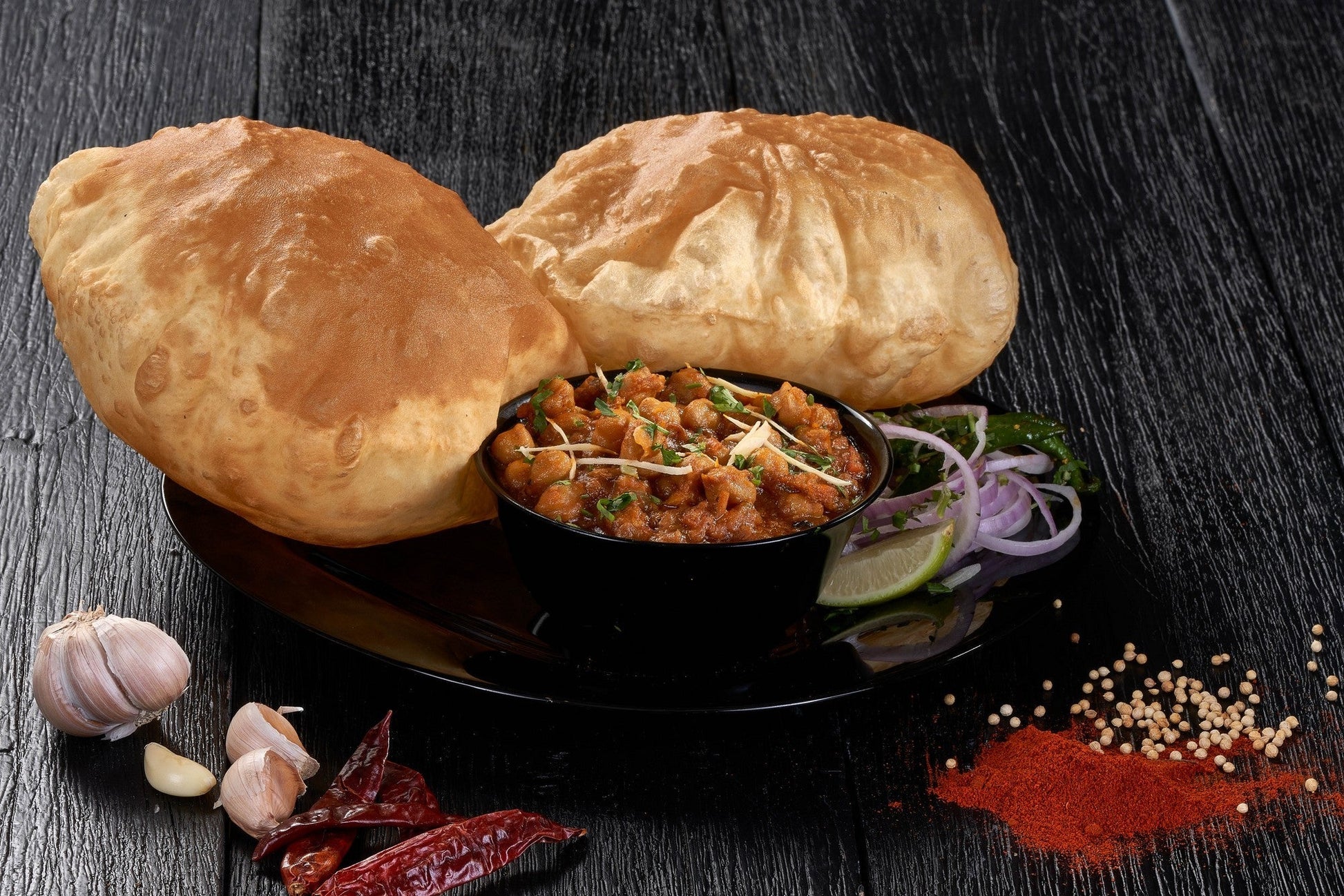 A plate of Chole Bhature, a traditional Indian dish consisting of spicy chickpea curry and deep-fried leavened bread