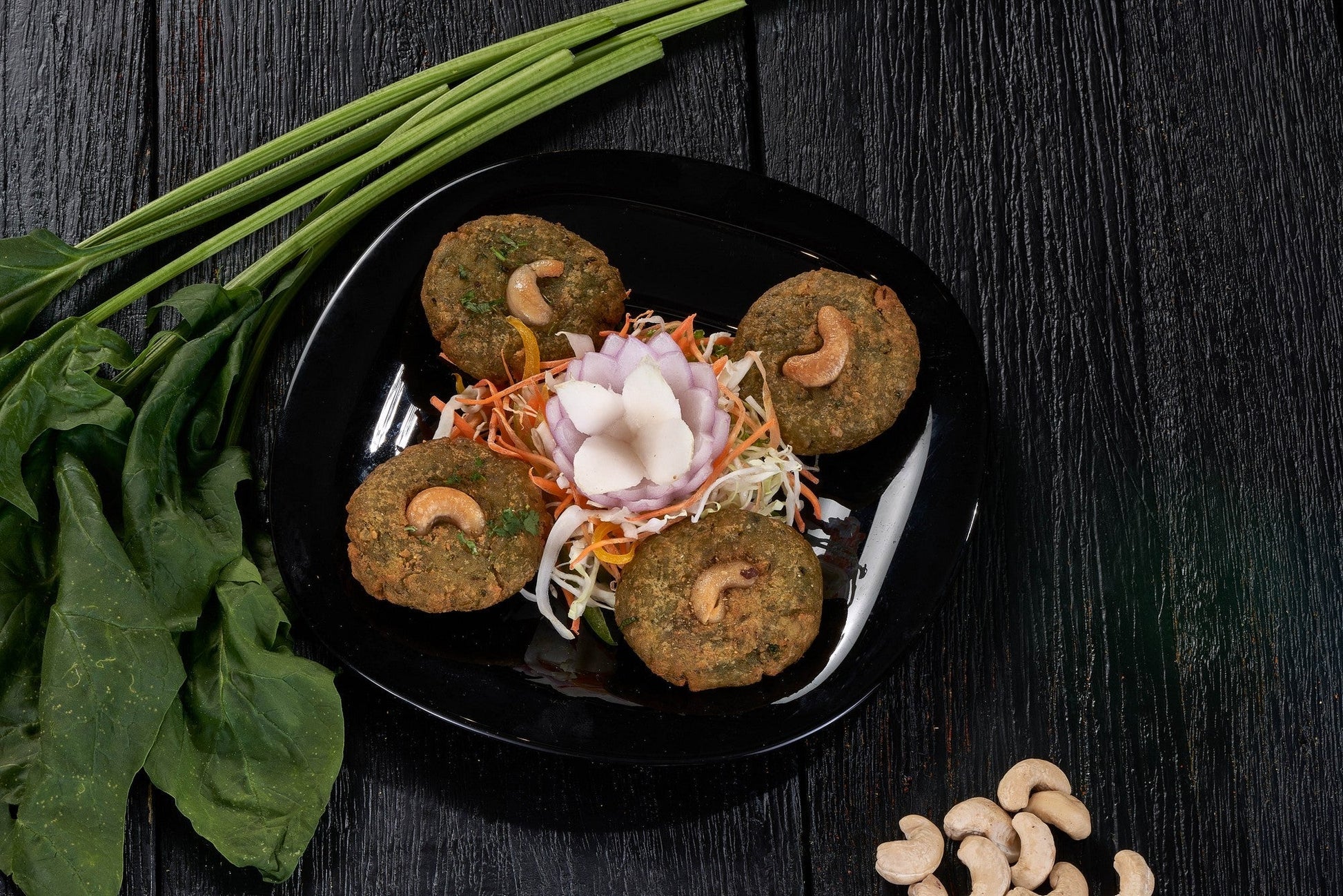 A crispy Harabara Kebab, a deep-fried patty made with spinach and fresh cottage cheese