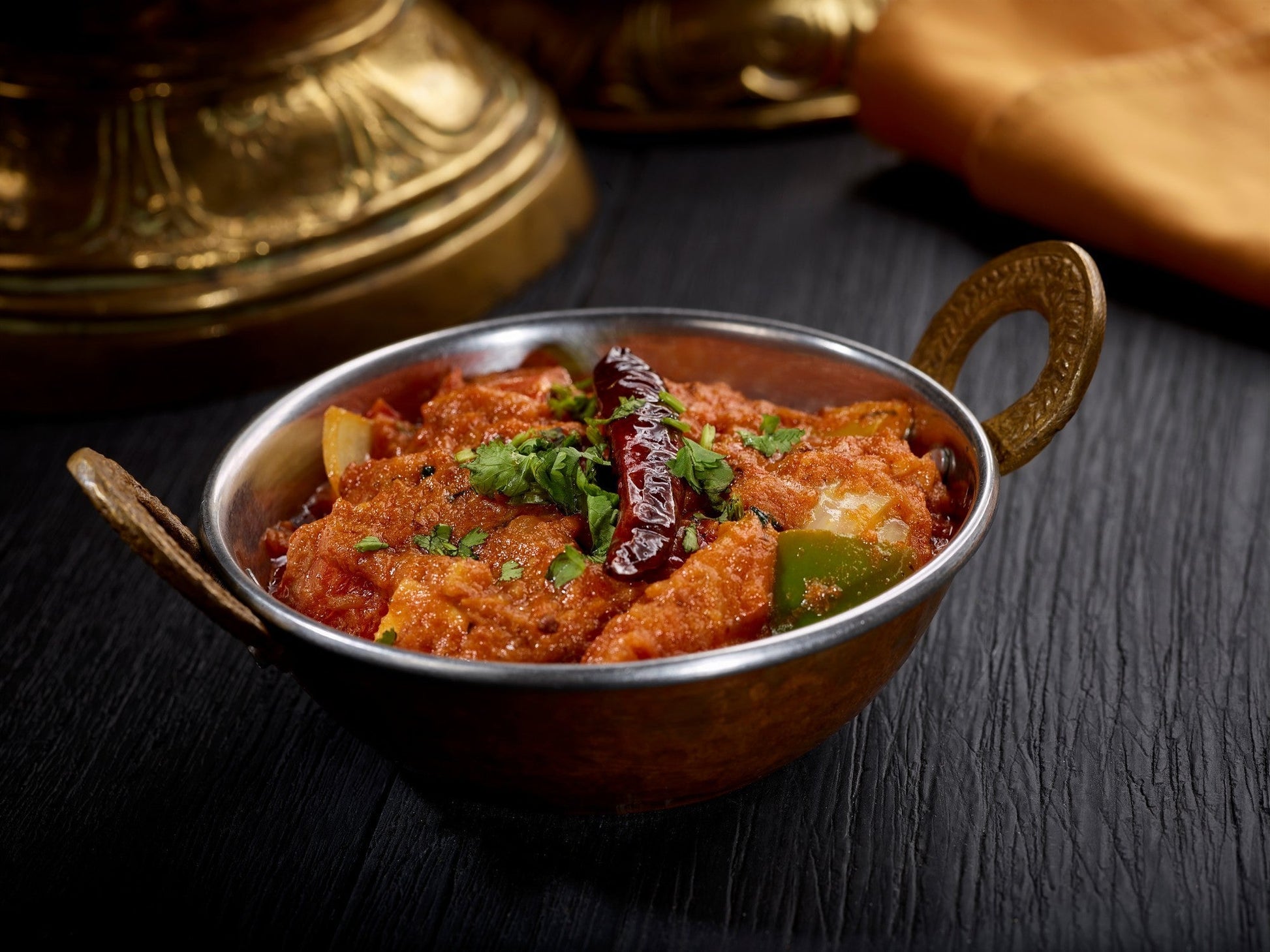 Flavorful Kadai dish, a rustic semi-dry gravy cooked with onions, tomatoes, bell peppers, and spices