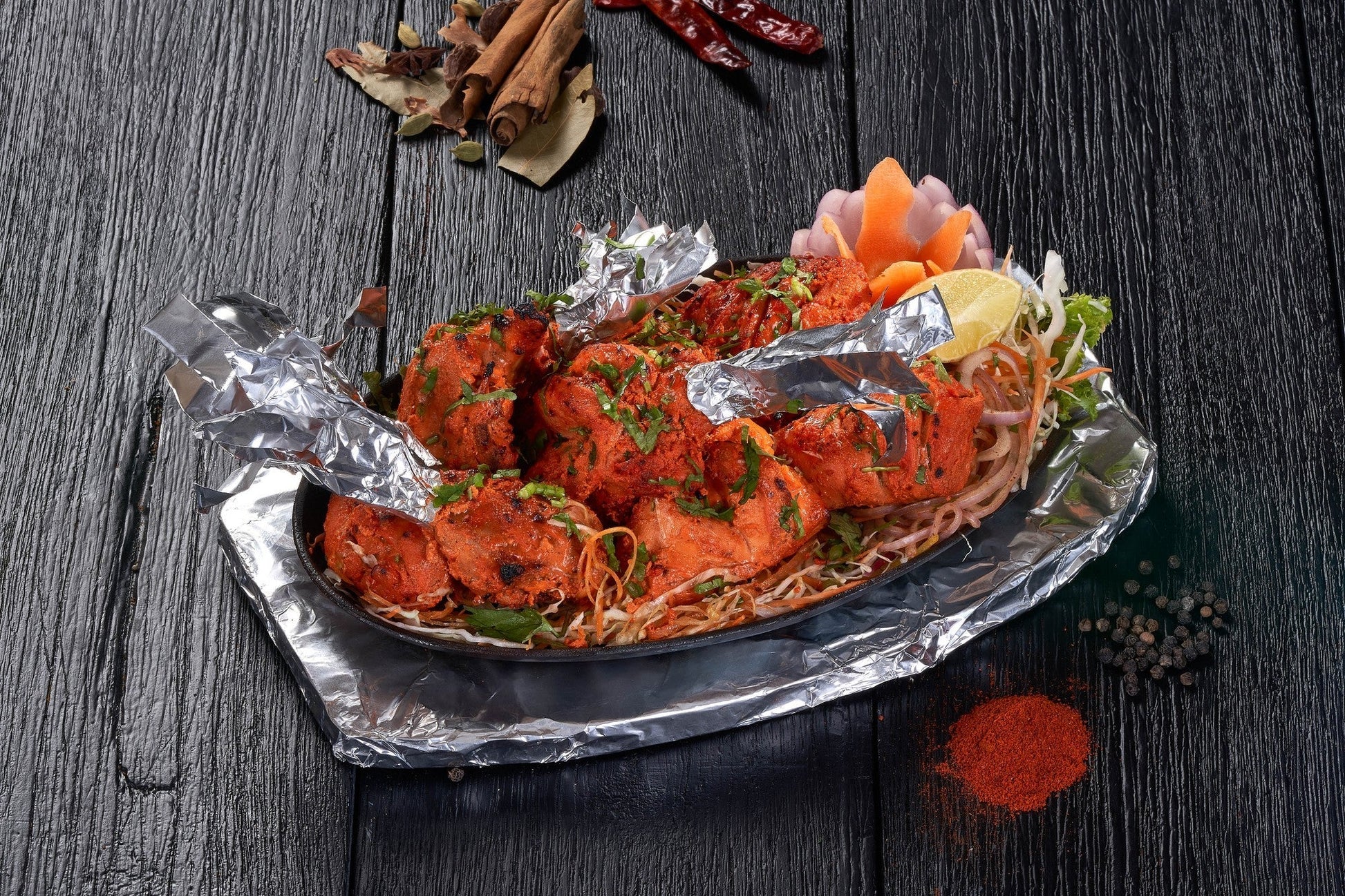 A whole Tandoori Murgh marinated in yogurt and spices